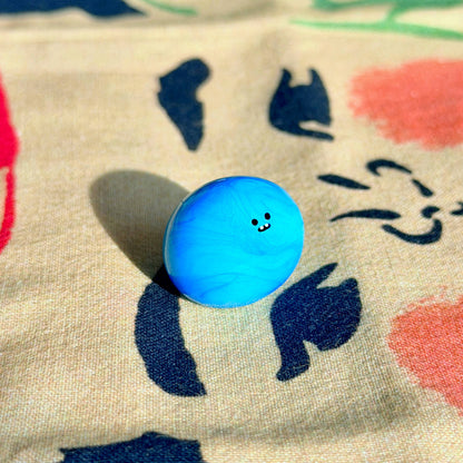 Bonino in a blue swirl color. Side facing.