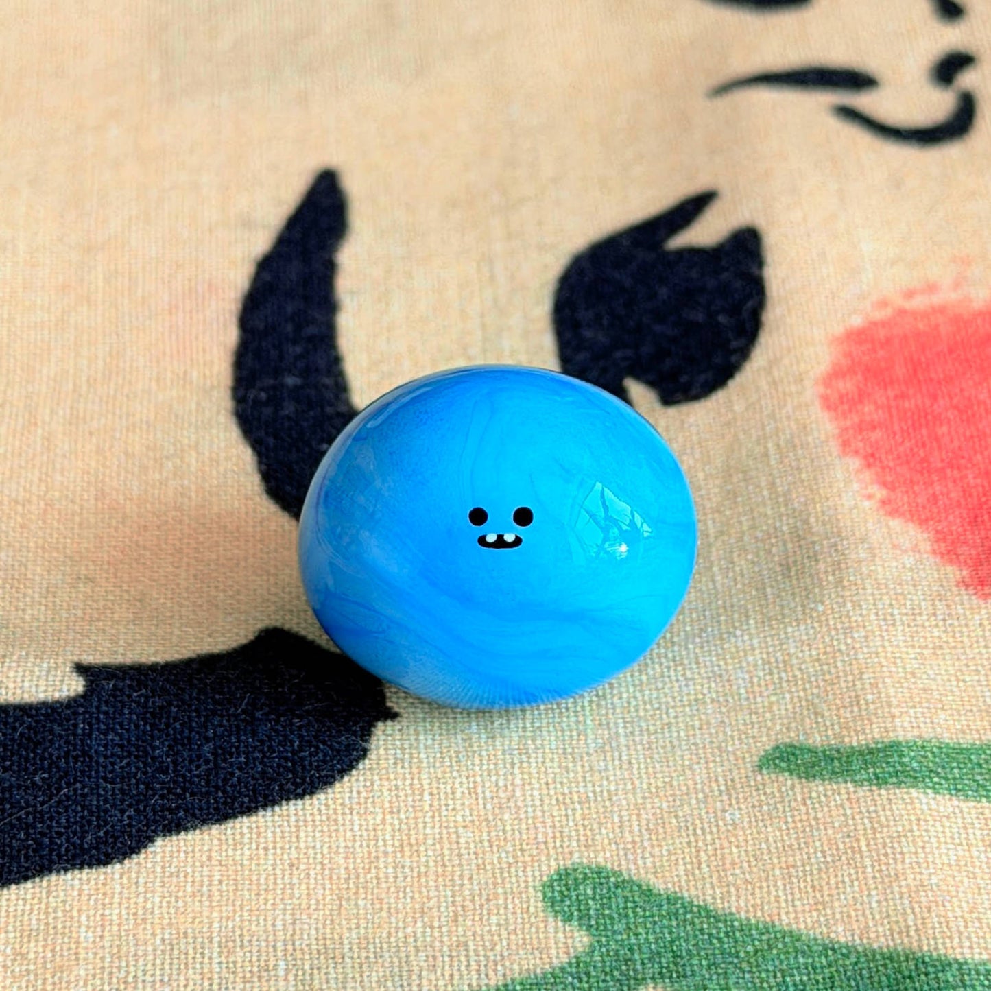 Bonino in a blue swirl color. Front facing.