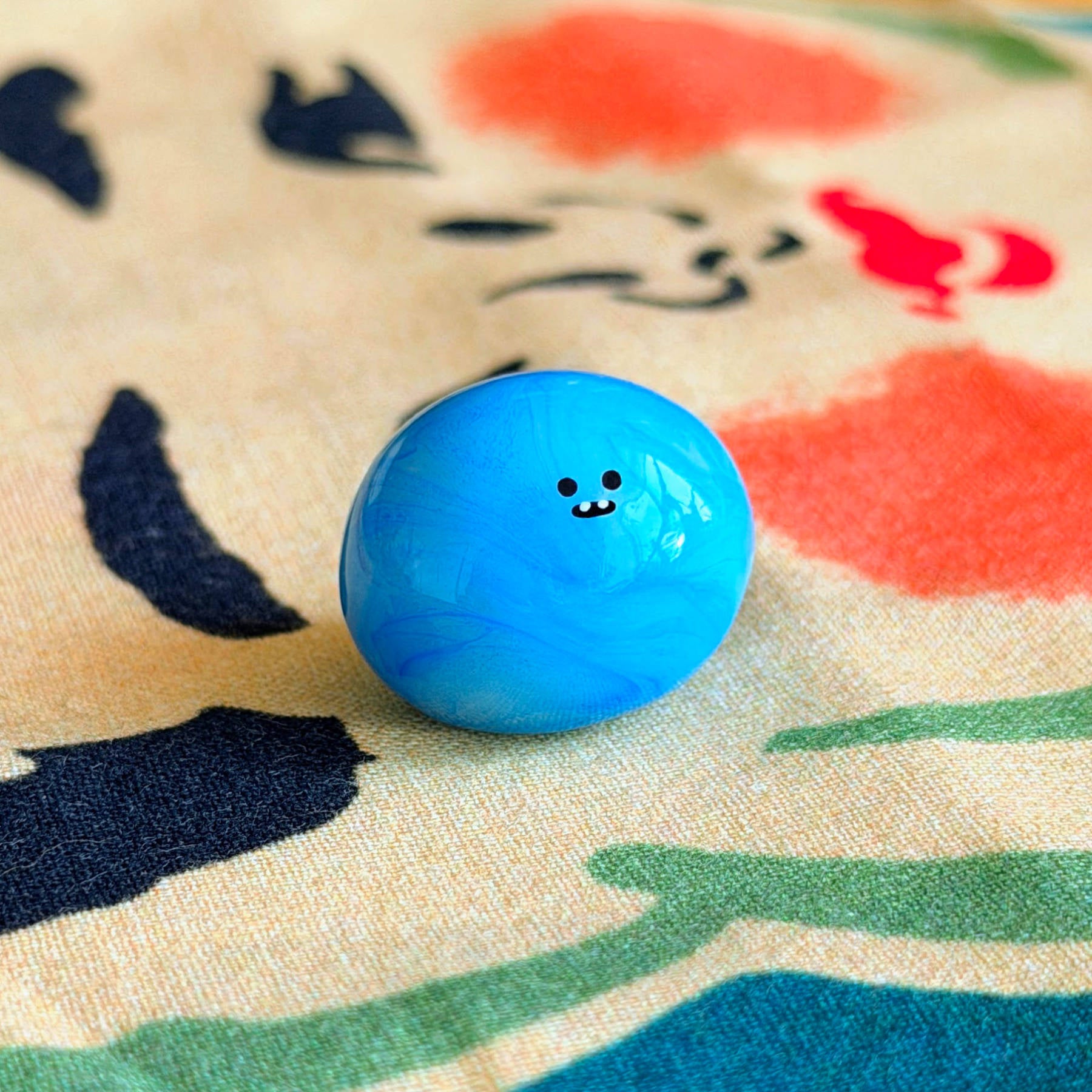 Bonino in a blue swirl color. Side facing.