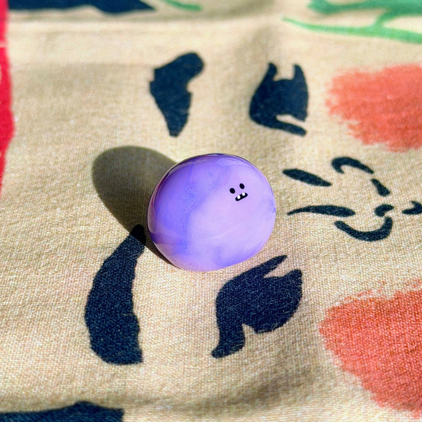 Bonino in a purple swirl color. Side facing.