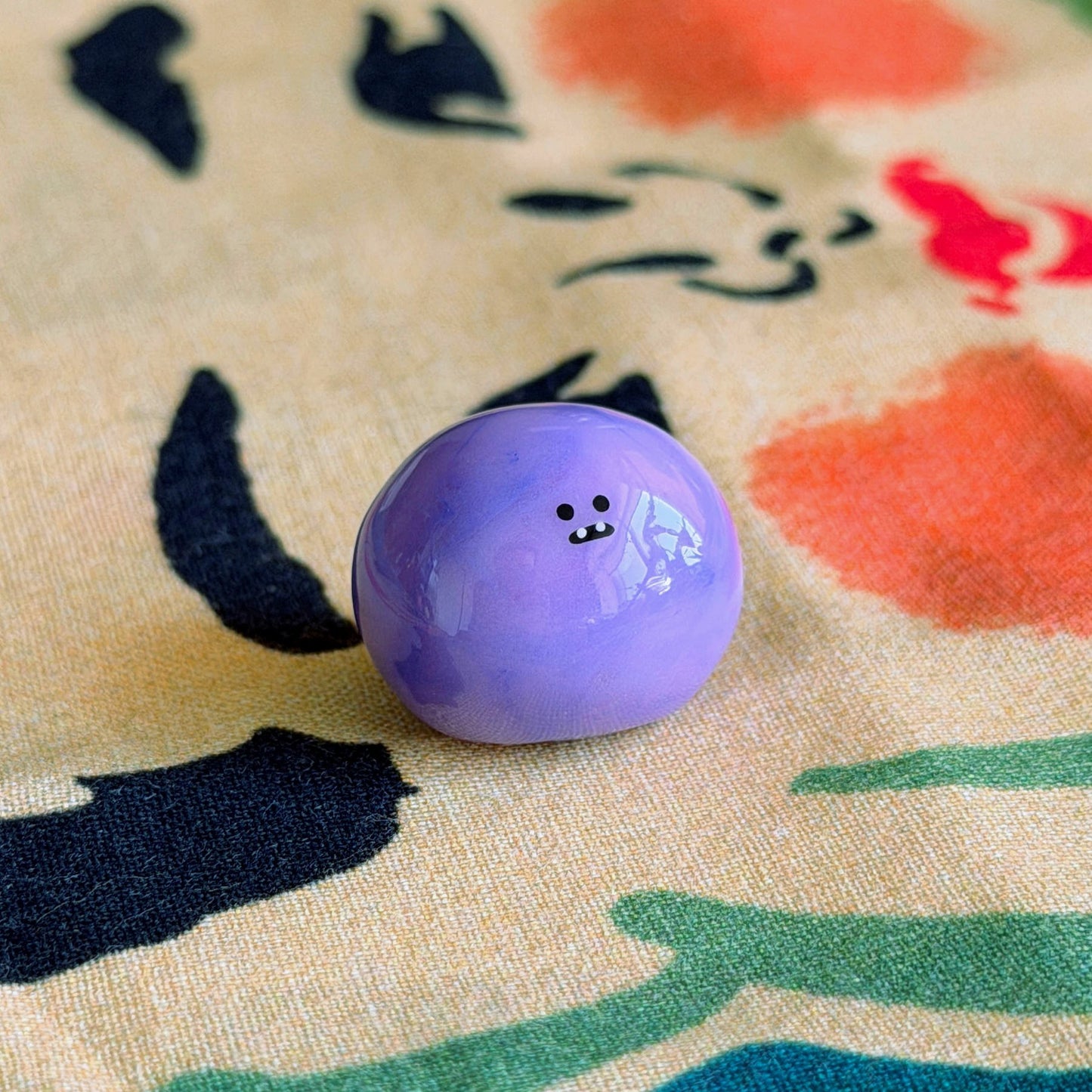 Bonino in a purple swirl color. Side facing.